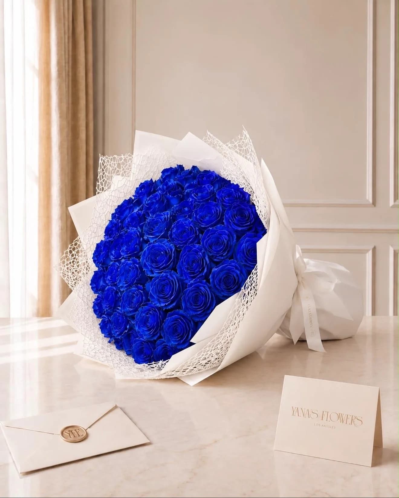 Cobalt Devotion wrapped bouquet by Yana's Flowers